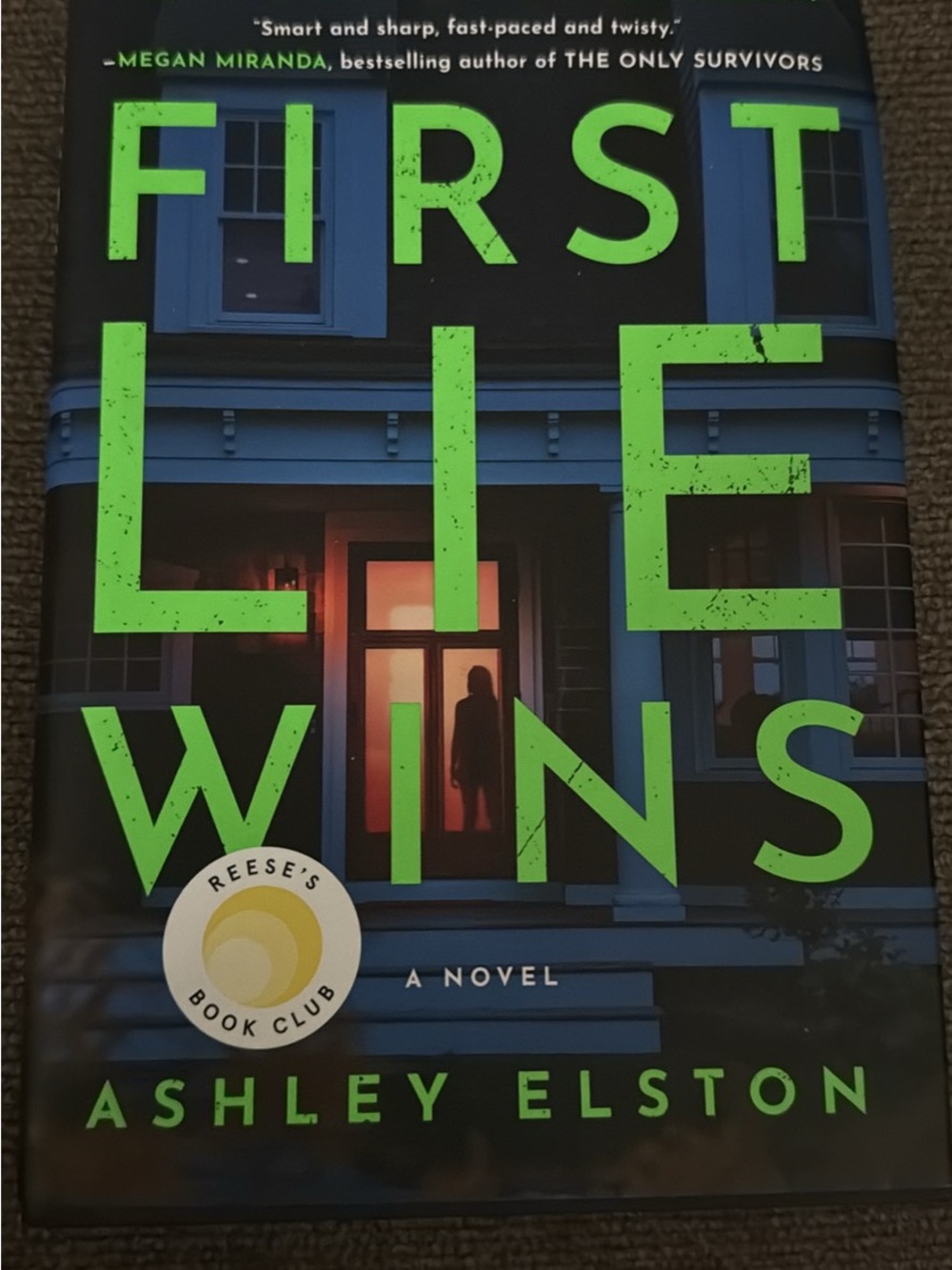 First Lie Wins by Ashley Elston - Hardcover Novel (Green & Blue Cover)